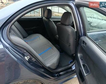 Синий Мицубиси Лансер, объемом двигателя 1.5 л и пробегом 211 тыс. км за 5222 $, фото 24 на Automoto.ua