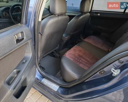 Синій Міцубісі Lancer, об'ємом двигуна 2 л та пробігом 234 тис. км за 6700 $, фото 13 на Automoto.ua