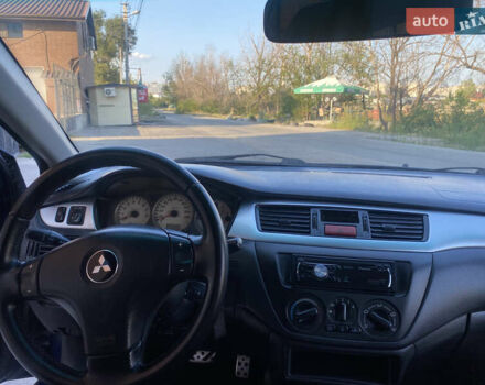 Синий Мицубиси Лансер, объемом двигателя 2 л и пробегом 100 тыс. км за 4999 $, фото 10 на Automoto.ua