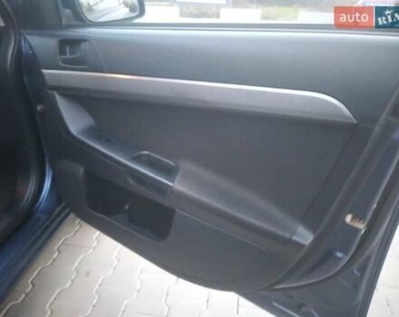 Синий Мицубиси Лансер, объемом двигателя 1.5 л и пробегом 260 тыс. км за 5000 $, фото 9 на Automoto.ua