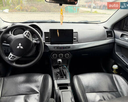 Синий Мицубиси Лансер, объемом двигателя 2 л и пробегом 326 тыс. км за 5650 $, фото 11 на Automoto.ua