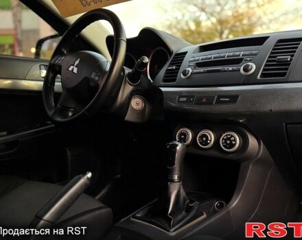 Синий Мицубиси Лансер, объемом двигателя 2 л и пробегом 189 тыс. км за 7350 $, фото 6 на Automoto.ua