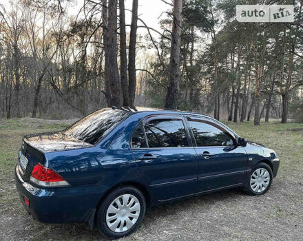 Синій Міцубісі Lancer, об'ємом двигуна 1.6 л та пробігом 176 тис. км за 6300 $, фото 6 на Automoto.ua