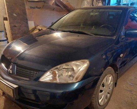 Синий Мицубиси Лансер, объемом двигателя 1.6 л и пробегом 87 тыс. км за 7000 $, фото 5 на Automoto.ua