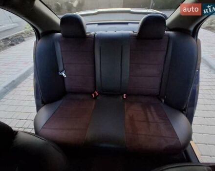 Синій Міцубісі Lancer, об'ємом двигуна 2 л та пробігом 234 тис. км за 6700 $, фото 12 на Automoto.ua