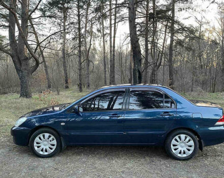 Синій Міцубісі Lancer, об'ємом двигуна 1.6 л та пробігом 176 тис. км за 6300 $, фото 7 на Automoto.ua