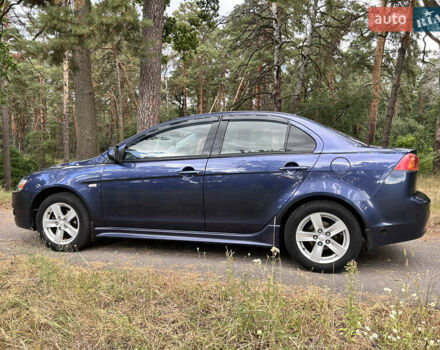 Синий Мицубиси Лансер, объемом двигателя 2 л и пробегом 312 тыс. км за 5750 $, фото 12 на Automoto.ua