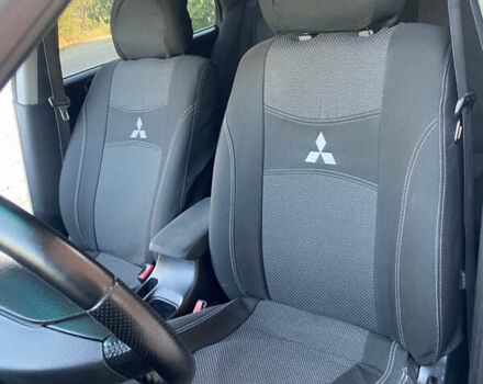 Синий Мицубиси Лансер, объемом двигателя 2 л и пробегом 100 тыс. км за 4999 $, фото 8 на Automoto.ua