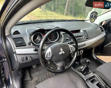 Синий Мицубиси Лансер, объемом двигателя 2 л и пробегом 312 тыс. км за 5750 $, фото 29 на Automoto.ua