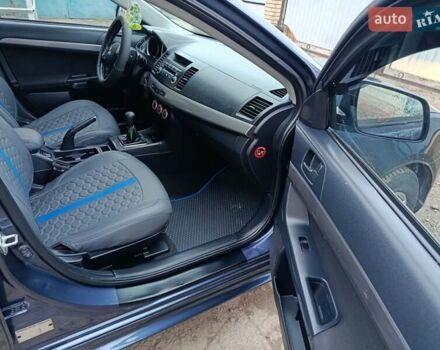 Синий Мицубиси Лансер, объемом двигателя 1.5 л и пробегом 211 тыс. км за 5222 $, фото 27 на Automoto.ua