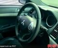 Синий Мицубиси Лансер, объемом двигателя 2 л и пробегом 176 тыс. км за 5500 $, фото 12 на Automoto.ua