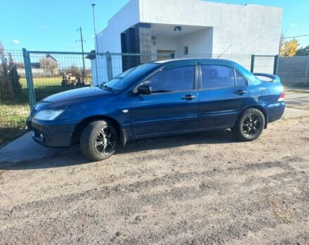 Синій Міцубісі Lancer, об'ємом двигуна 1 л та пробігом 111 тис. км за 3100 $, фото 5 на Automoto.ua