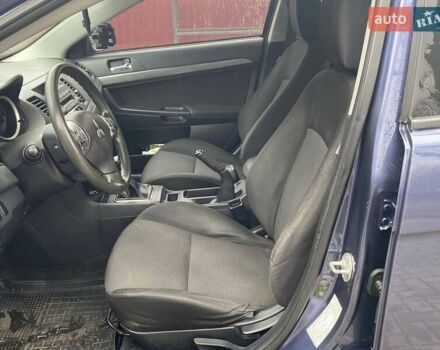 Синій Міцубісі Lancer, об'ємом двигуна 2 л та пробігом 210 тис. км за 6800 $, фото 17 на Automoto.ua