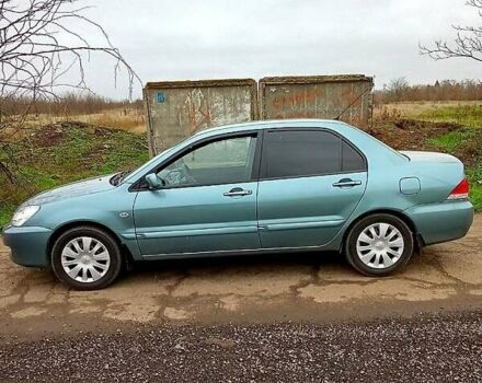 Синий Мицубиси Лансер, объемом двигателя 1.6 л и пробегом 167 тыс. км за 4700 $, фото 1 на Automoto.ua