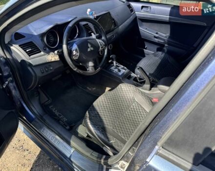Синій Міцубісі Lancer, об'ємом двигуна 2 л та пробігом 300 тис. км за 5800 $, фото 10 на Automoto.ua
