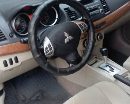 Синий Мицубиси Лансер, объемом двигателя 2 л и пробегом 300 тыс. км за 6900 $, фото 11 на Automoto.ua