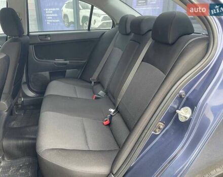 Синий Мицубиси Лансер, объемом двигателя 2 л и пробегом 142 тыс. км за 8000 $, фото 13 на Automoto.ua