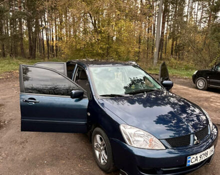 Синий Мицубиси Лансер, объемом двигателя 1.6 л и пробегом 150 тыс. км за 5700 $, фото 23 на Automoto.ua