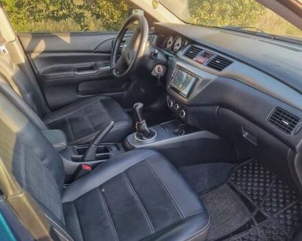 Синий Мицубиси Лансер, объемом двигателя 1.6 л и пробегом 197 тыс. км за 6500 $, фото 13 на Automoto.ua