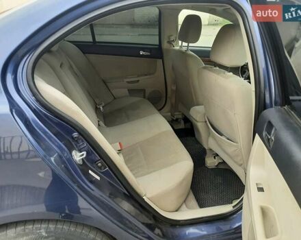 Синий Мицубиси Лансер, объемом двигателя 1.5 л и пробегом 220 тыс. км за 6999 $, фото 31 на Automoto.ua