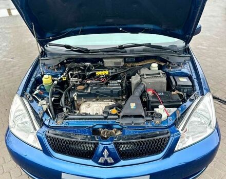 Синий Мицубиси Лансер, объемом двигателя 1.6 л и пробегом 153 тыс. км за 5400 $, фото 2 на Automoto.ua