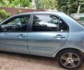 Синій Міцубісі Lancer, об'ємом двигуна 1.58 л та пробігом 215 тис. км за 5200 $, фото 1 на Automoto.ua