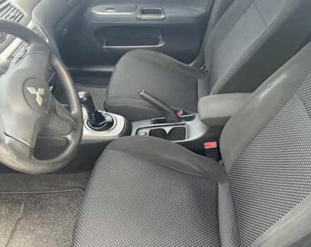 Синій Міцубісі Lancer, об'ємом двигуна 1.6 л та пробігом 206 тис. км за 5500 $, фото 11 на Automoto.ua
