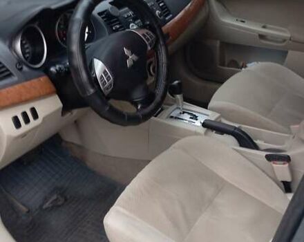 Синий Мицубиси Лансер, объемом двигателя 2 л и пробегом 300 тыс. км за 6900 $, фото 10 на Automoto.ua