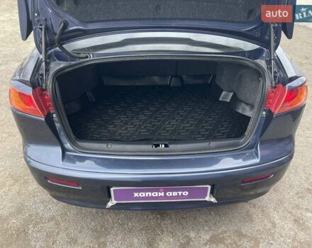 Синий Мицубиси Лансер, объемом двигателя 2 л и пробегом 142 тыс. км за 8000 $, фото 8 на Automoto.ua