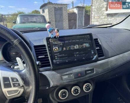 Синій Міцубісі Lancer, об'ємом двигуна 2 л та пробігом 300 тис. км за 5800 $, фото 9 на Automoto.ua