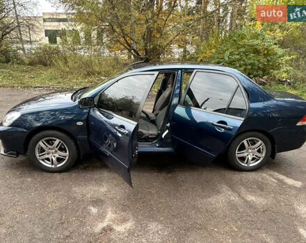 Синий Мицубиси Лансер, объемом двигателя 1.6 л и пробегом 150 тыс. км за 5700 $, фото 29 на Automoto.ua