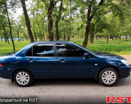 Синій Міцубісі Lancer, об'ємом двигуна 1.6 л та пробігом 225 тис. км за 4250 $, фото 3 на Automoto.ua
