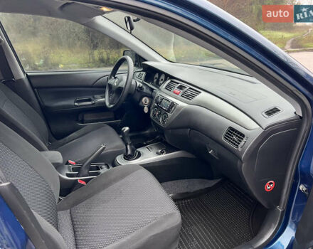 Синий Мицубиси Лансер, объемом двигателя 1.59 л и пробегом 126 тыс. км за 5950 $, фото 11 на Automoto.ua