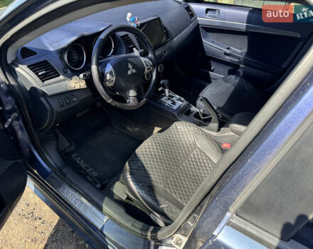 Синий Мицубиси Лансер, объемом двигателя 2 л и пробегом 299 тыс. км за 7100 $, фото 9 на Automoto.ua