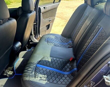 Синій Міцубісі Lancer, об'ємом двигуна 2 л та пробігом 207 тис. км за 7500 $, фото 4 на Automoto.ua