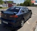 Синий Мицубиси Лансер, объемом двигателя 2 л и пробегом 230 тыс. км за 5650 $, фото 1 на Automoto.ua