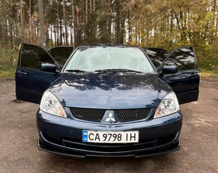 Синий Мицубиси Лансер, объемом двигателя 1.6 л и пробегом 150 тыс. км за 5700 $, фото 24 на Automoto.ua