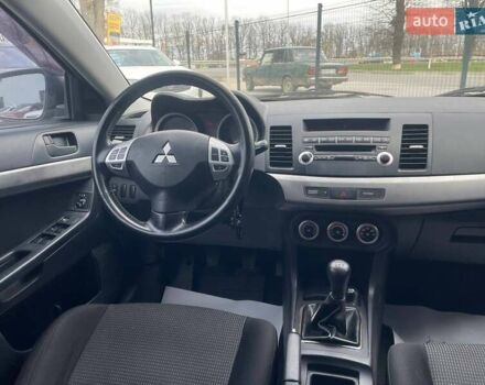 Синий Мицубиси Лансер, объемом двигателя 2 л и пробегом 142 тыс. км за 8000 $, фото 29 на Automoto.ua