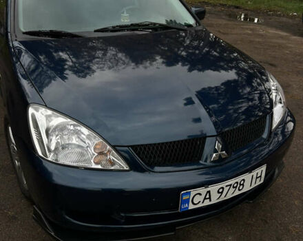 Синий Мицубиси Лансер, объемом двигателя 1.6 л и пробегом 150 тыс. км за 5700 $, фото 57 на Automoto.ua