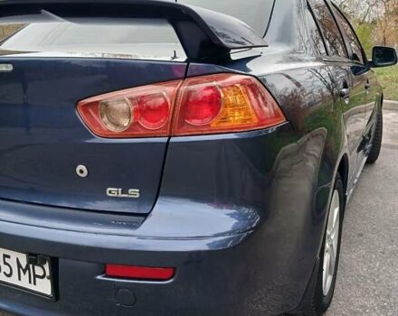 Синий Мицубиси Лансер, объемом двигателя 1.5 л и пробегом 220 тыс. км за 6999 $, фото 23 на Automoto.ua