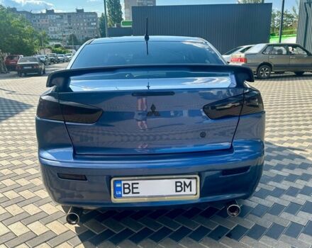 Синий Мицубиси Лансер, объемом двигателя 2 л и пробегом 250 тыс. км за 6800 $, фото 5 на Automoto.ua