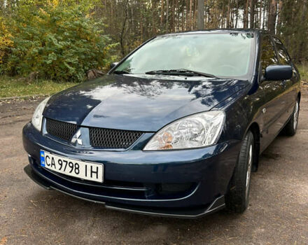 Синий Мицубиси Лансер, объемом двигателя 1.6 л и пробегом 150 тыс. км за 5700 $, фото 58 на Automoto.ua