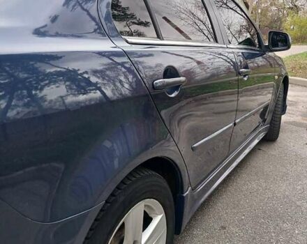 Синий Мицубиси Лансер, объемом двигателя 1.5 л и пробегом 220 тыс. км за 6999 $, фото 19 на Automoto.ua