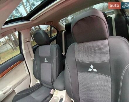Синий Мицубиси Лансер, объемом двигателя 1.5 л и пробегом 220 тыс. км за 6999 $, фото 5 на Automoto.ua