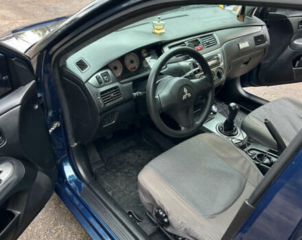 Синий Мицубиси Лансер, объемом двигателя 1.6 л и пробегом 150 тыс. км за 5700 $, фото 30 на Automoto.ua