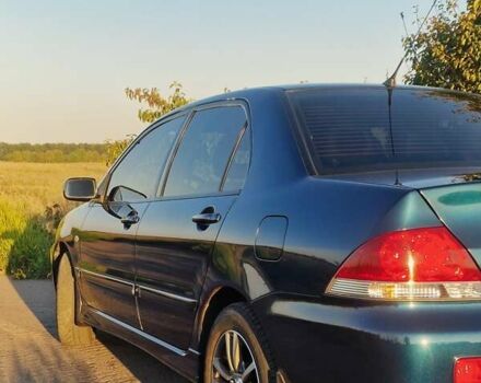 Синий Мицубиси Лансер, объемом двигателя 1.6 л и пробегом 197 тыс. км за 6500 $, фото 5 на Automoto.ua