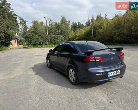 Синий Мицубиси Лансер, объемом двигателя 2 л и пробегом 299 тыс. км за 7100 $, фото 2 на Automoto.ua