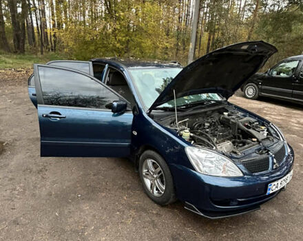 Синий Мицубиси Лансер, объемом двигателя 1.6 л и пробегом 150 тыс. км за 5700 $, фото 12 на Automoto.ua