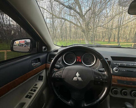 Синий Мицубиси Лансер, объемом двигателя 1.5 л и пробегом 250 тыс. км за 5150 $, фото 7 на Automoto.ua