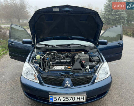 Синий Мицубиси Лансер, объемом двигателя 1.59 л и пробегом 126 тыс. км за 5950 $, фото 8 на Automoto.ua